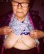 Granny hag shows her ugly tits.