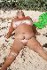 Naked granny in the sand