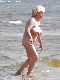 Older naked granny in the ocean