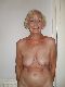 Granny blonde showing off nice shaped breasts