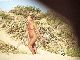 Mature nudist voyeured at beach (2 of 2).